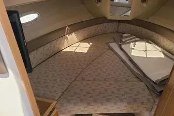  Yacht Photos Pics 2023 Cutwater C-248 Coupe interior cabin with cozy seating and natural light.