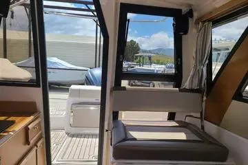  Yacht Photos Pics Interior view of 2023 Cutwater C-248 Coupe boat, showcasing seating and deck area.