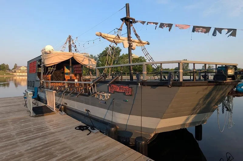  Yacht Photos Pics Custom 2016 pirate ship docked, featuring rustic design and decorative flags.