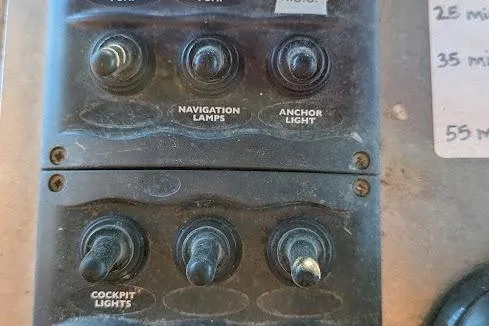  Yacht Photos Pics Control panel with switches for navigation lamps, anchor light, and cockpit lights on a custom pirate ship.