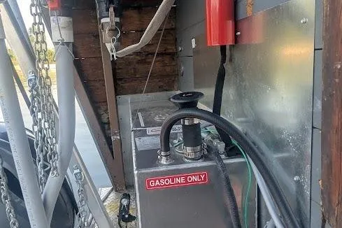  Yacht Photos Pics Gasoline pump on a 2016 custom pirate ship, featuring chains and safety equipment.