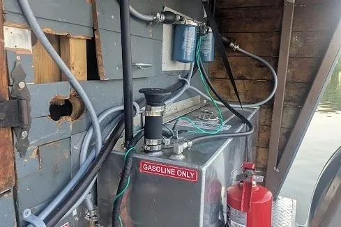  Yacht Photos Pics Engine compartment of a 2016 custom pirate ship with gasoline tank and fire extinguisher.