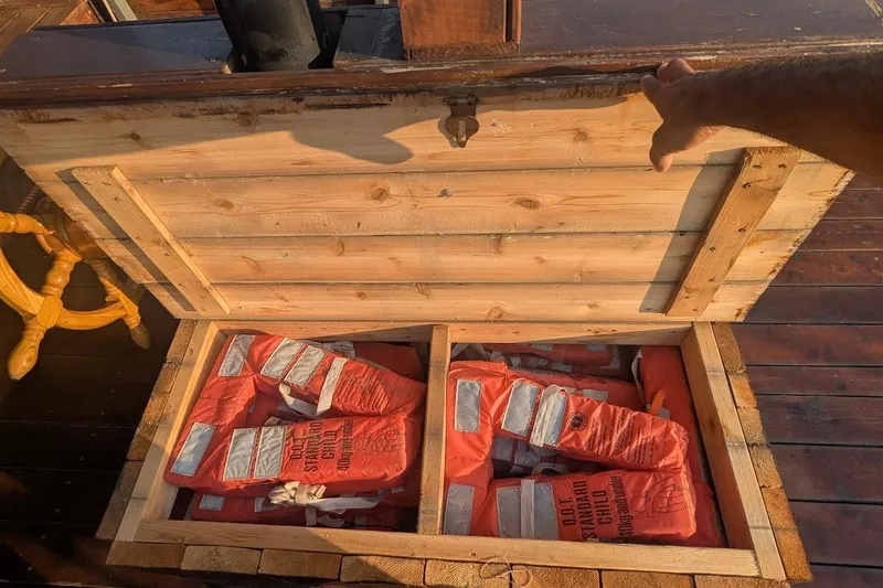  Yacht Photos Pics Wooden chest on pirate ship containing orange life jackets, Custom model, 2016.