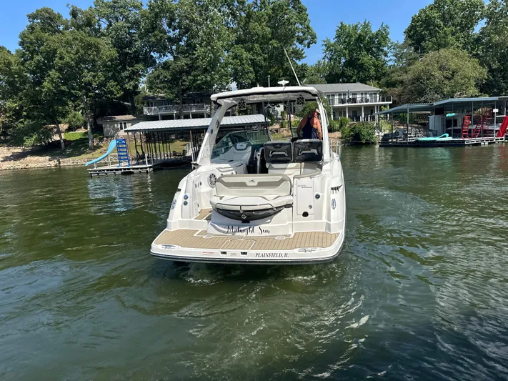  Yacht Photos Pics 2017 Monterey 355 Sport Yacht cruising on a lake near docks and trees.