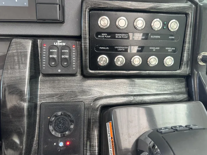  Yacht Photos Pics Control panel of a 2017 Monterey 355 Sport Yacht with various switches and buttons.