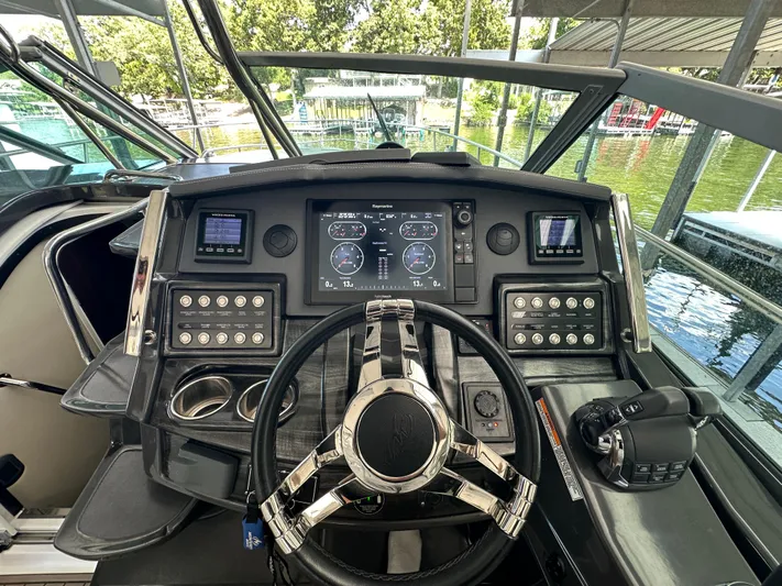  Yacht Photos Pics 2017 Monterey 355 Sport Yacht helm with advanced navigation controls and displays.