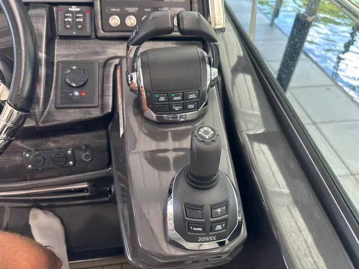  Yacht Photos Pics Control panel of a 2017 Monterey 355 Sport Yacht with joystick and throttle controls.