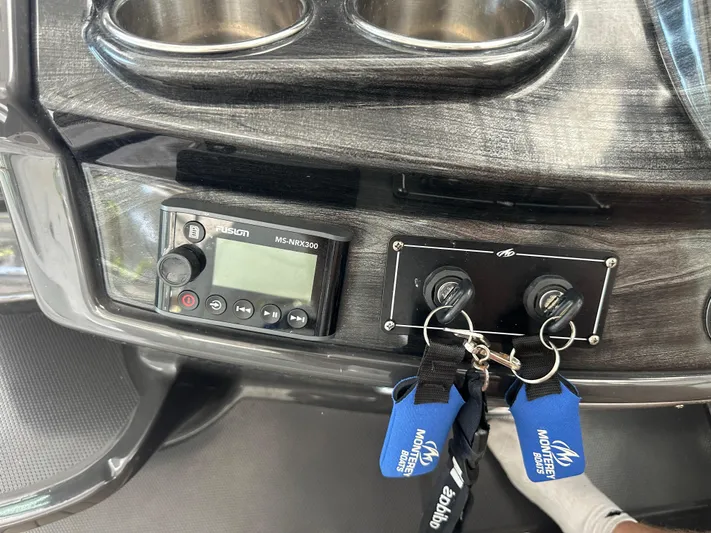  Yacht Photos Pics Control panel of a 2017 Monterey 355 Sport Yacht with keys and Fusion MS-NRX300.