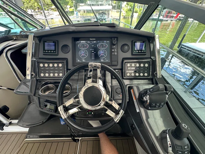  Yacht Photos Pics Cockpit of 2017 Monterey 355 Sport Yacht with advanced navigation controls and steering wheel.