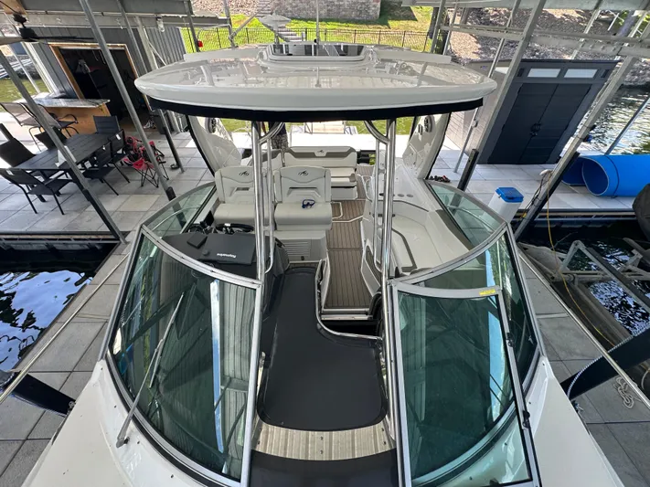  Yacht Photos Pics 2017 Monterey 355 Sport Yacht docked in a marina, showcasing sleek design and spacious interior.