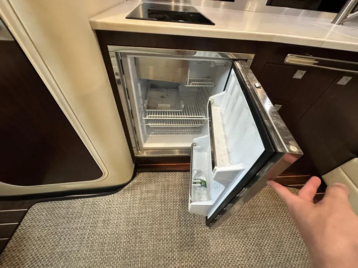  Yacht Photos Pics Open mini fridge in 2017 Monterey 355 Sport Yacht kitchen area.