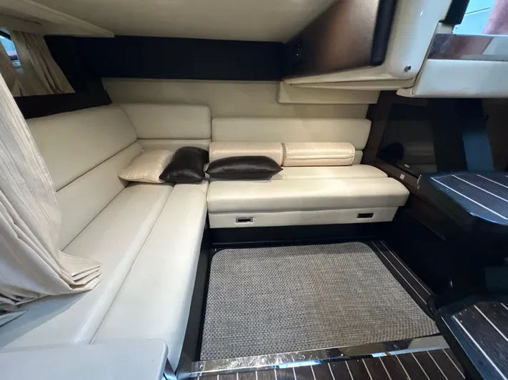  Yacht Photos Pics Luxurious interior of 2017 Monterey 355 Sport Yacht with cream leather seating.