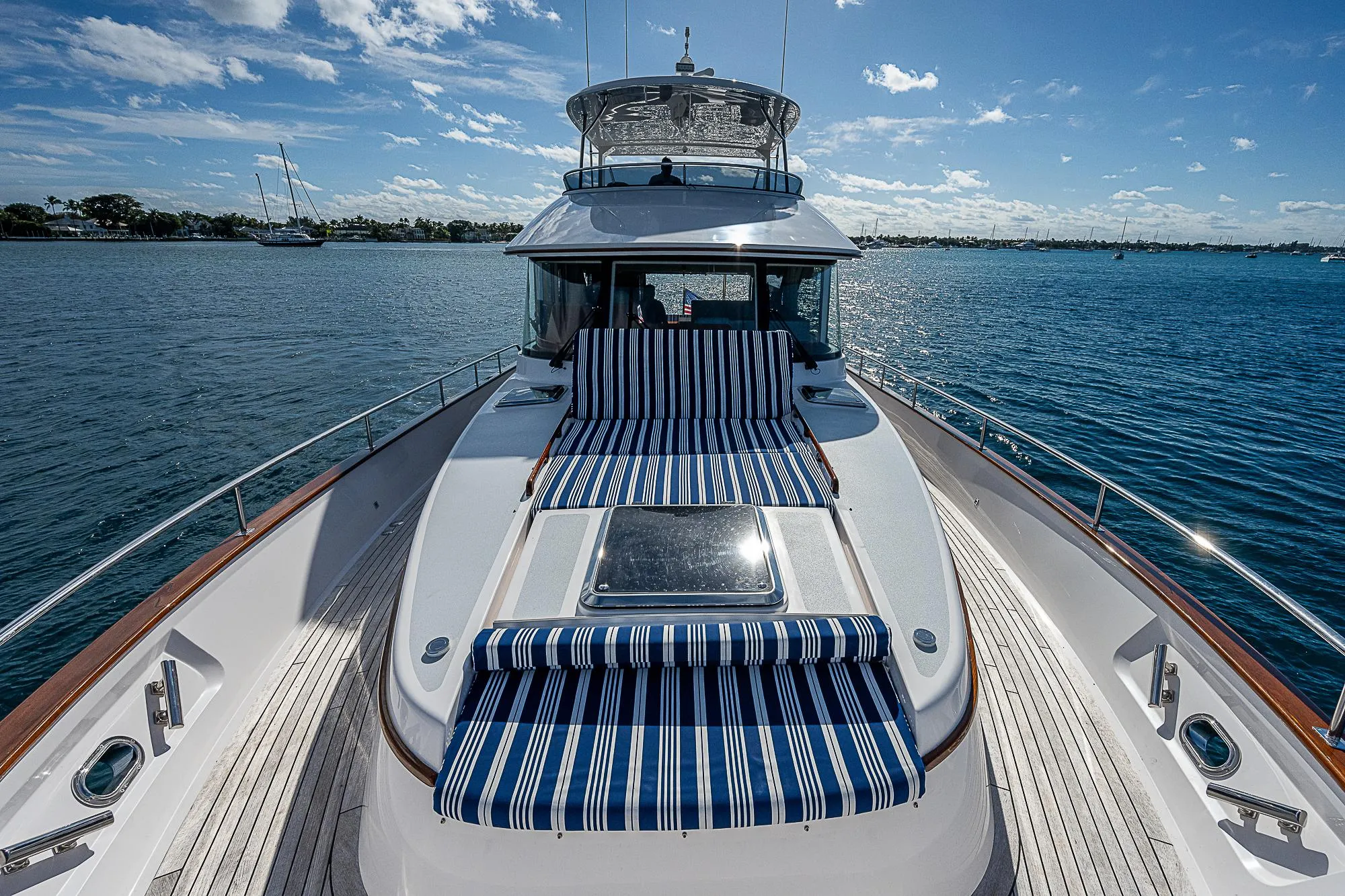 2022 Summit 54 Motoryacht with striped deck cushions on open water.