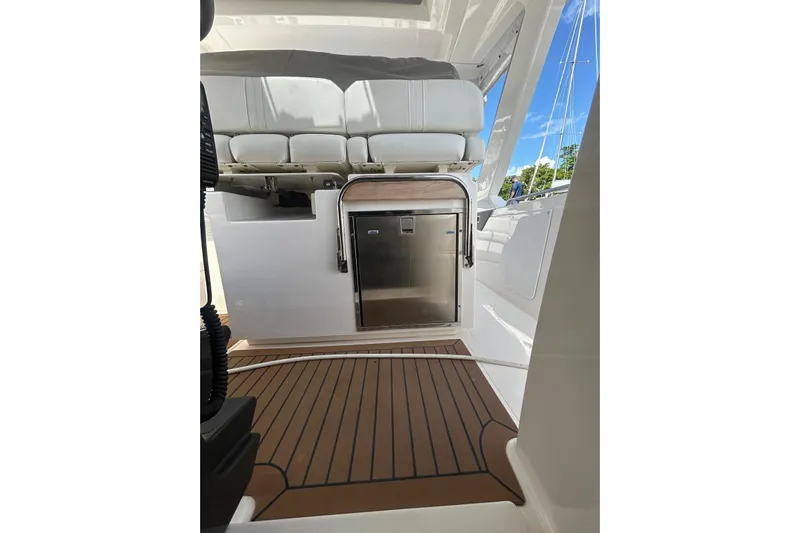  Yacht Photos Pics 2021 Tiara Yachts 34 LS interior with seating and stainless steel appliance.