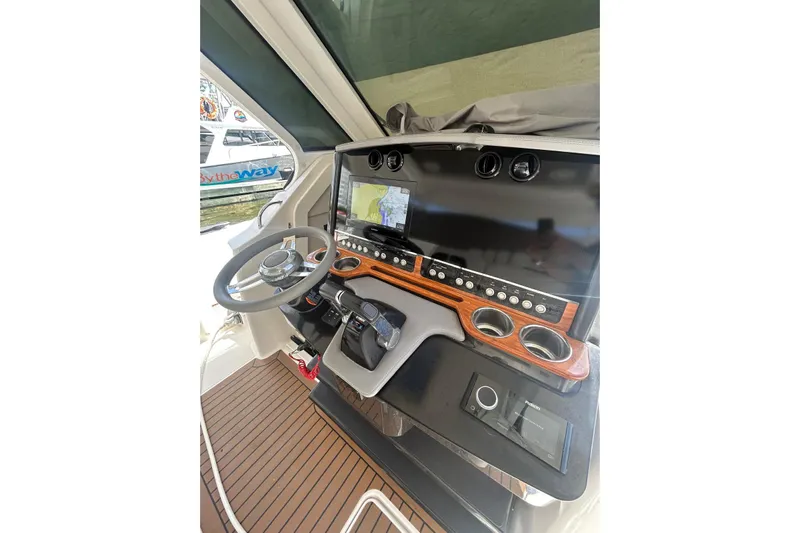  Yacht Photos Pics 2021 Tiara Yachts 34 LS helm with modern controls and navigation display.