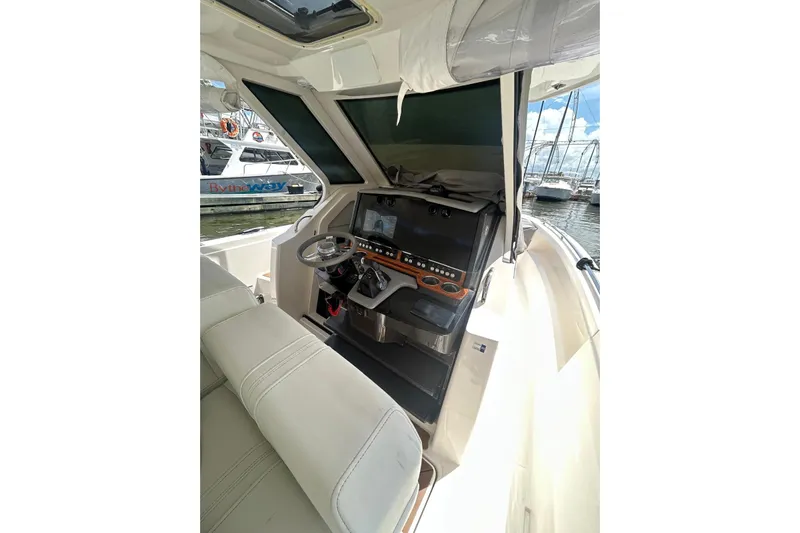  Yacht Photos Pics 2021 Tiara Yachts 34 LS helm with modern controls and comfortable seating.