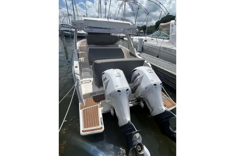  Yacht Photos Pics 2021 Tiara Yachts 34 LS with twin Yamaha engines docked at marina.
