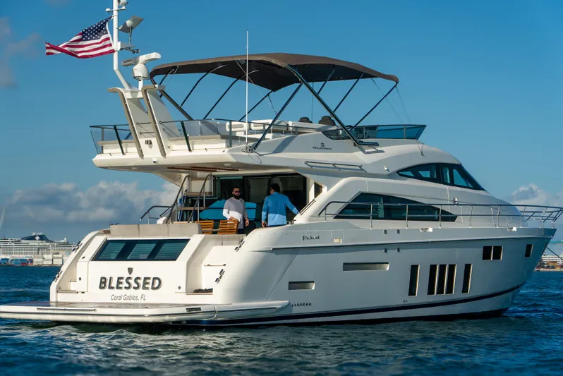 Blessed Yacht Photos Pics 2015 Fairline Squadron 65 yacht cruising on open water under clear blue skies.