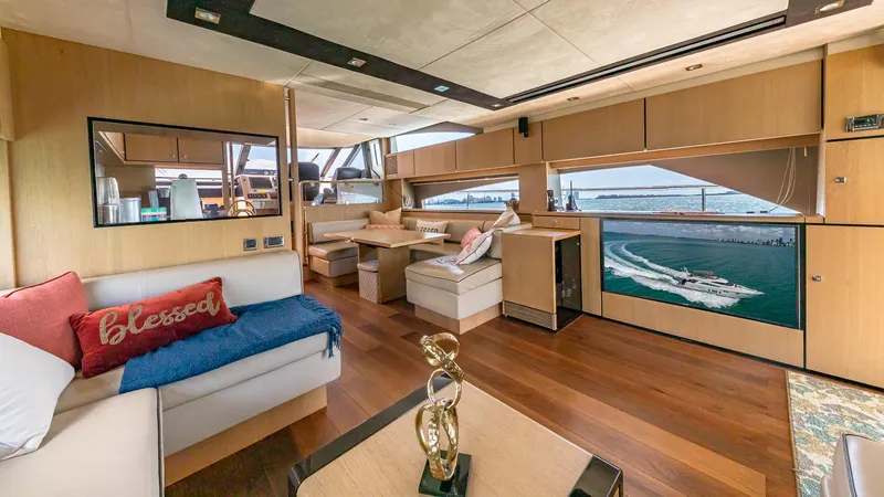 Blessed Yacht Photos Pics Luxurious interior of 2015 Fairline Squadron 65 yacht with modern furnishings and ocean view.