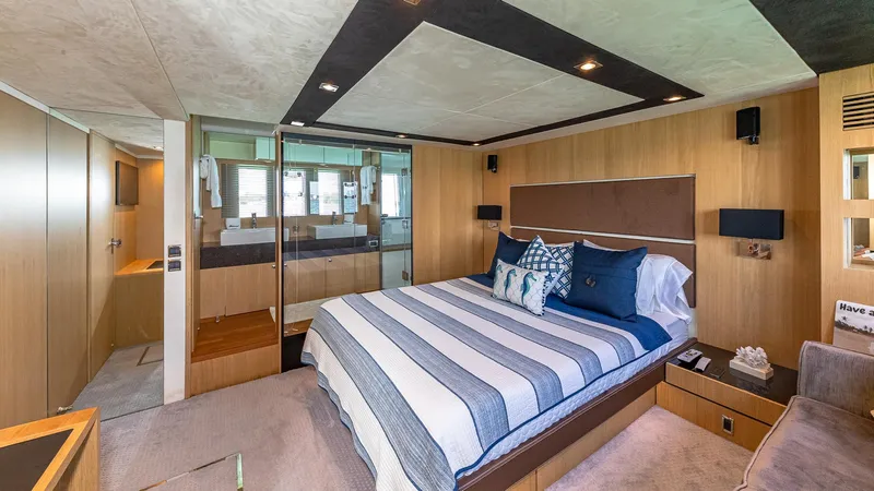 Blessed Yacht Photos Pics Luxurious bedroom interior of 2015 Fairline Squadron 65 yacht with modern design and cozy bedding.