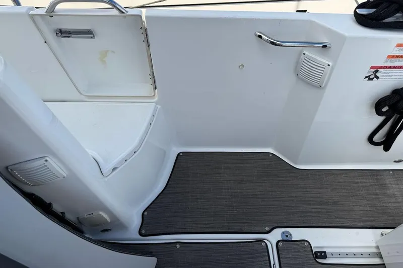 Pisces Yacht Photos Pics 2021 Jeanneau NC 895 boat interior with sleek flooring and storage compartment.