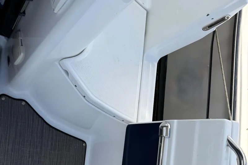 Pisces Yacht Photos Pics Interior view of 2021 Jeanneau NC 895 boat, featuring sleek white surfaces and modern design.