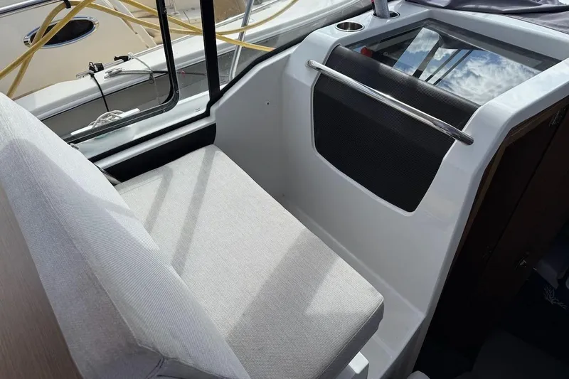 Pisces Yacht Photos Pics Interior seating area of 2021 Jeanneau NC 895 boat, featuring modern design and comfort.
