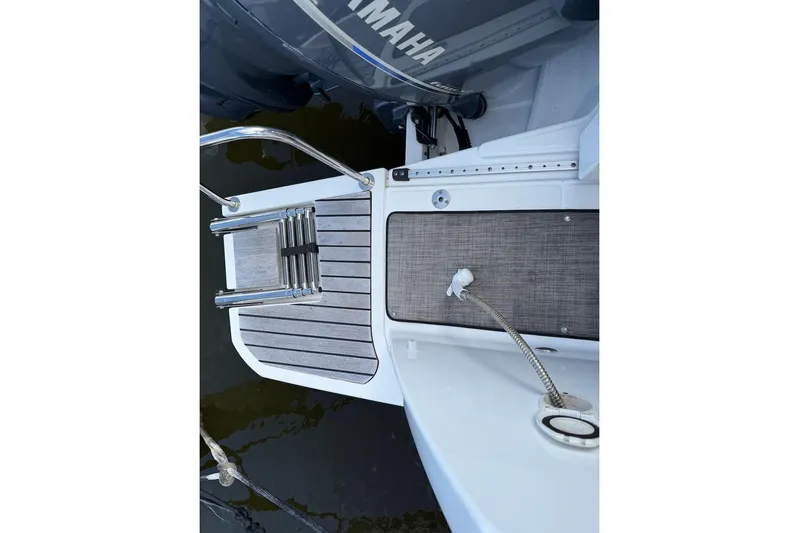 Pisces Yacht Photos Pics 2021 Jeanneau NC 895 boat deck with Yamaha engine and swim ladder.