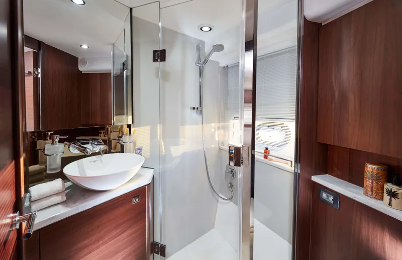  Yacht Photos Pics Luxurious bathroom in 2025 Princess V50 Open yacht with modern fixtures and wood accents.