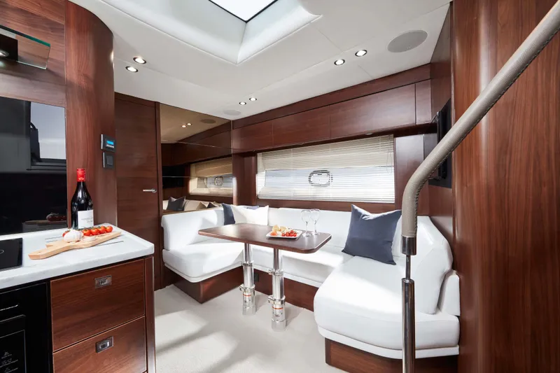  Yacht Photos Pics Luxurious interior of 2025 Princess V50 Open yacht with elegant seating and dining area.