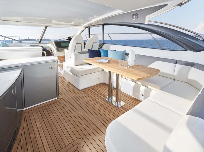 Yacht Photos Pics Luxurious 2025 Princess V50 Open yacht interior with elegant seating and ocean view.