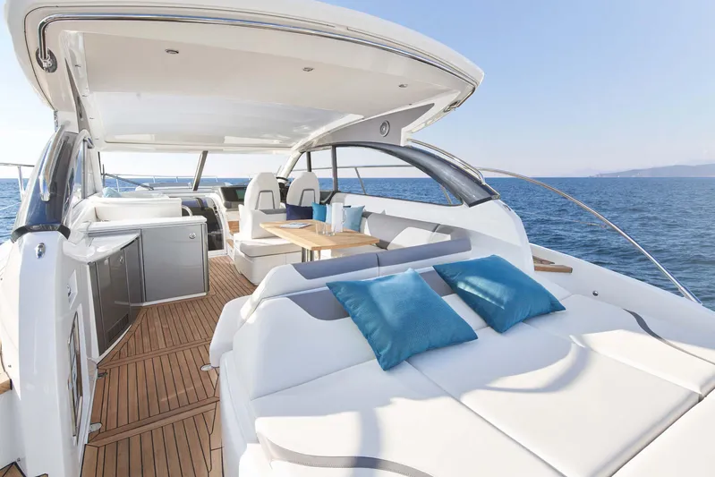  Yacht Photos Pics Luxurious 2025 Princess V50 Open yacht with spacious deck and modern seating.