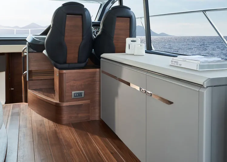  Yacht Photos Pics Interior of 2025 Princess V50 Open yacht with sleek wood and modern design.