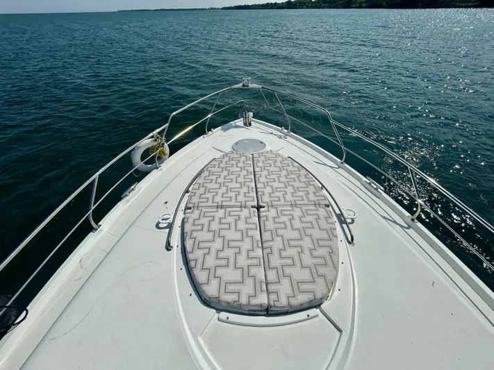  Yacht Photos Pics 2011 Cruisers Yachts 48 Cantius bow view on open water.