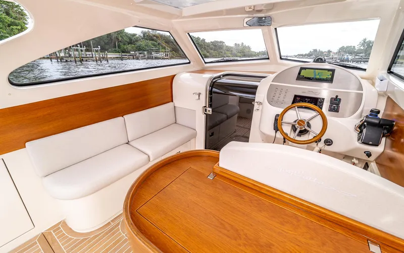 Penrose Yacht Photos Pics Luxurious interior of 2020 Gagliotta Lobster 35 yacht with wood accents and modern helm.