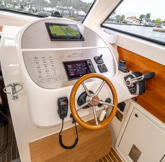 Penrose Yacht Photos Pics Gagliotta Lobster 35 helm with modern navigation equipment and wooden steering wheel, 2020 model.