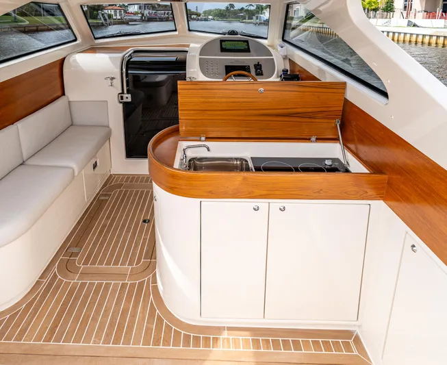 Penrose Yacht Photos Pics Interior of 2020 Gagliotta Lobster 35 boat with modern kitchen and seating area.