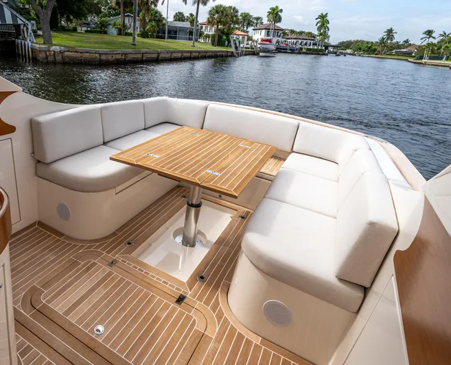 Penrose Yacht Photos Pics Luxurious seating area on 2020 Gagliotta Lobster 35 yacht by a scenic waterway.