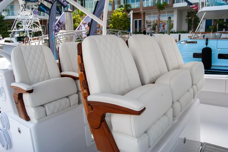  Yacht Photos Pics Luxurious seating on 2025 Front Runner 43 Catamaran, featuring elegant white upholstery and wooden accents.