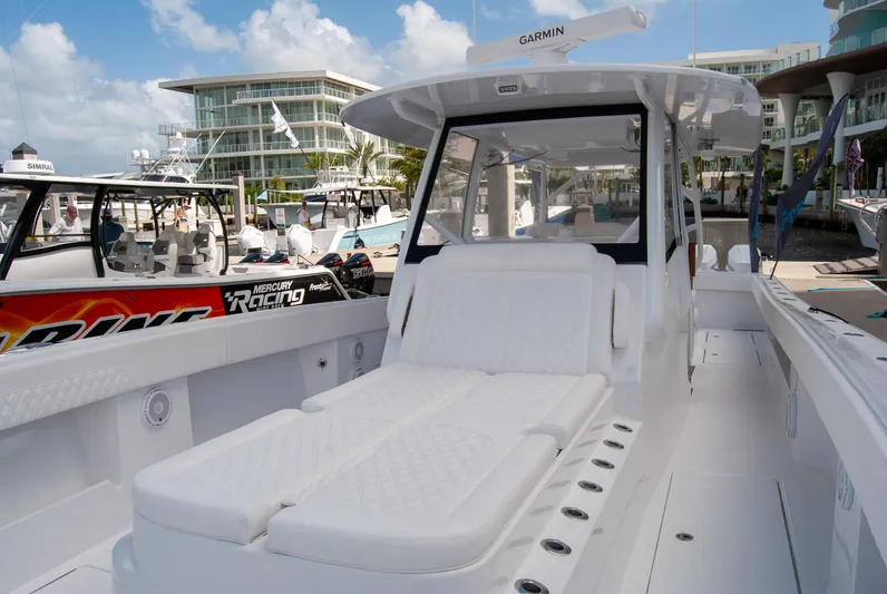  Yacht Photos Pics 2025 Front Runner 43 Catamaran with white seating, docked at a marina.