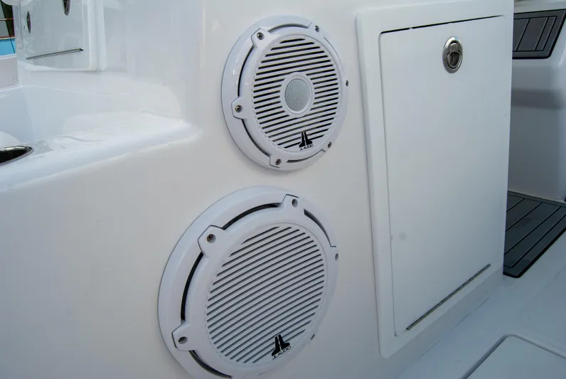  Yacht Photos Pics Speakers on 2025 Front Runner 43 Catamaran, white panel with storage compartment.