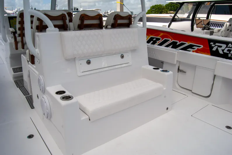  Yacht Photos Pics 2025 Front Runner 43 Catamaran interior with white seating and cup holders.