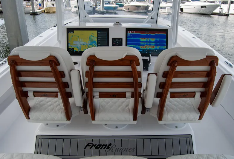  Yacht Photos Pics 2025 Front Runner 43 Catamaran cockpit with three seats and navigation screens.