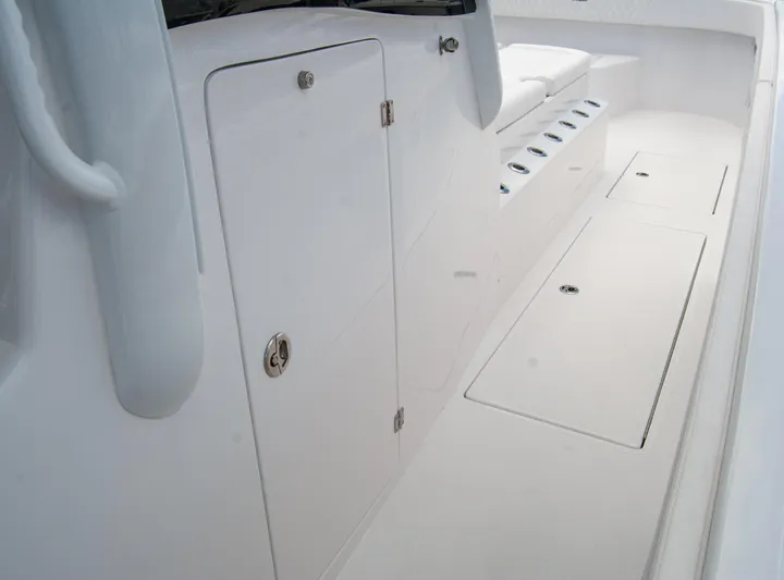  Yacht Photos Pics 2025 Front Runner 43 Catamaran interior with sleek white storage compartments.
