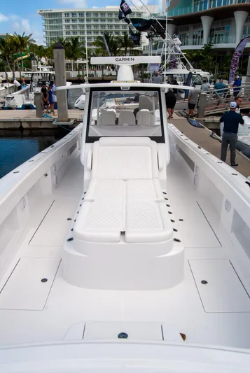  Yacht Photos Pics 2025 Front Runner 43 Catamaran docked at marina, showcasing spacious deck and modern design.