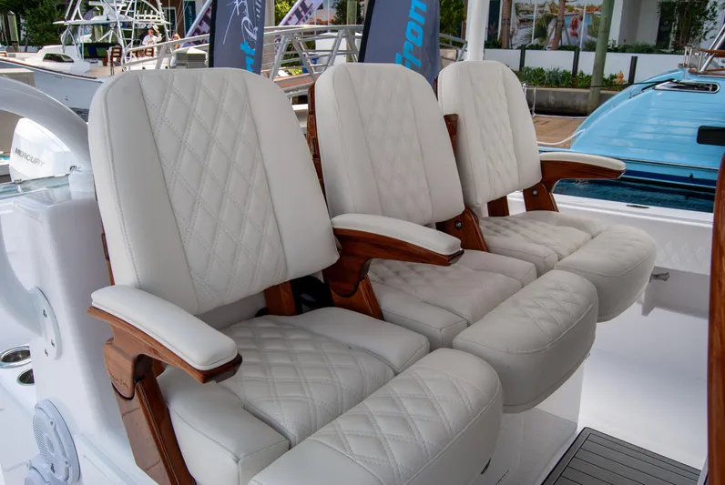  Yacht Photos Pics Luxury seating on 2025 Front Runner 43 Catamaran, featuring elegant white upholstery and wooden accents.