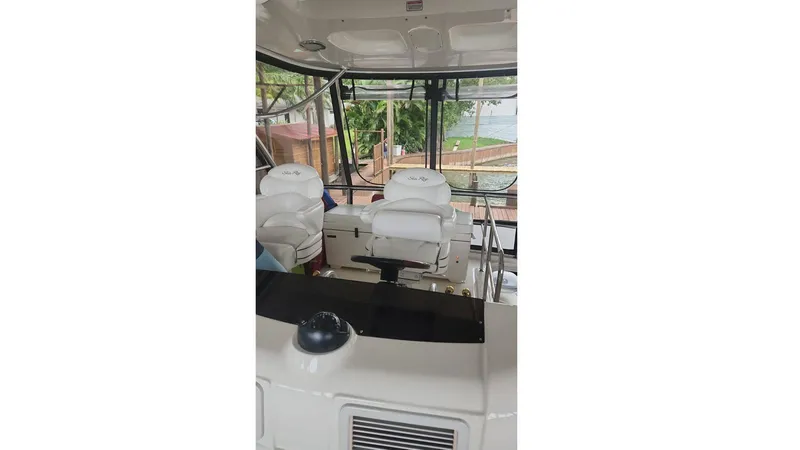  Yacht Photos Pics Interior view of 2007 Sea Ray 52 Sedan Bridge yacht cockpit.