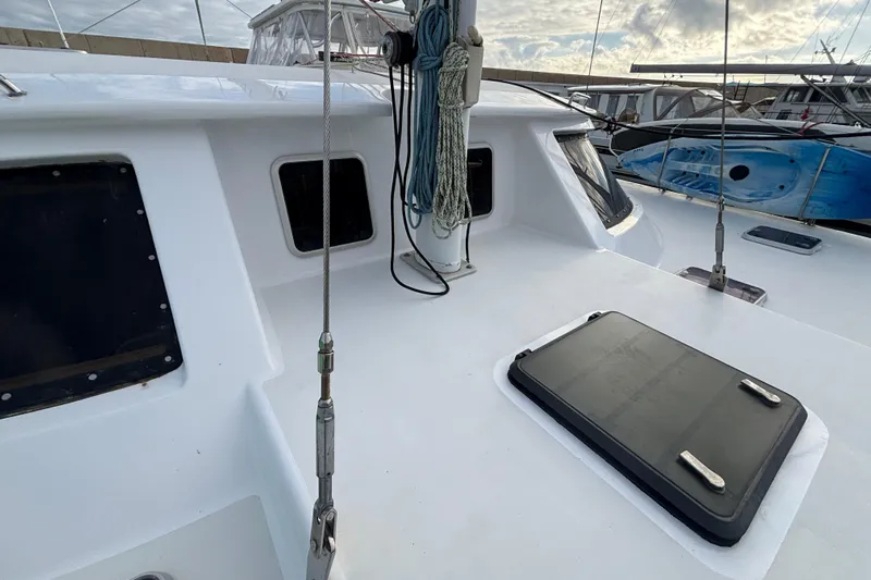  Yacht Photos Pics 2009 Kelsall 58 KSS yacht deck with hatches and rigging, docked at marina.