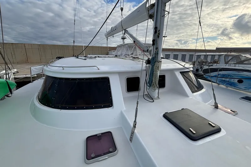  Yacht Photos Pics 2009 Kelsall 58 KSS catamaran docked at marina under cloudy sky.