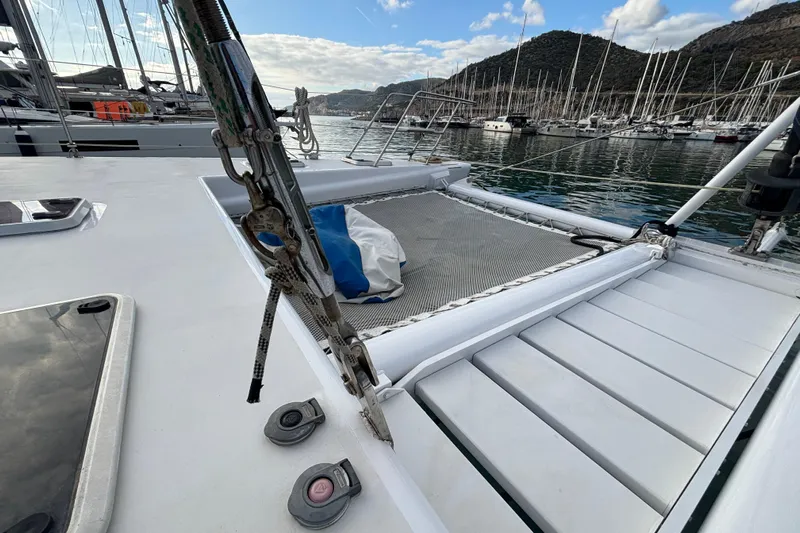 Yacht Photos Pics Deck view of 2009 Kelsall 58 KSS catamaran in a marina with mountains in background.